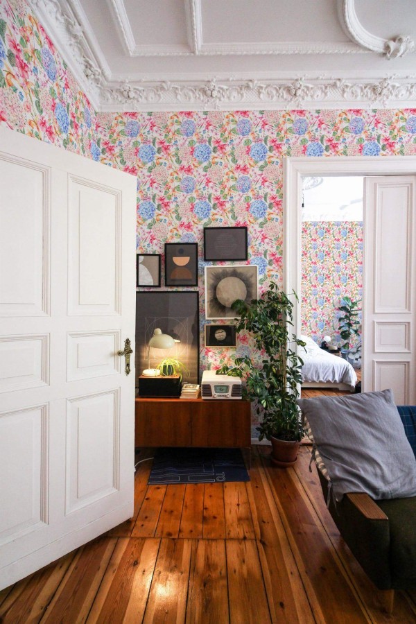 Mid-century modern luxury style living room and bedroom decorated with Bright floral peel and stick wallpaper