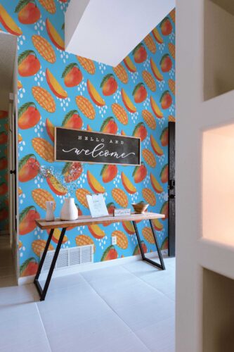 Bright mango peel and stick wallpaper by Fancy Walls in tropical blue