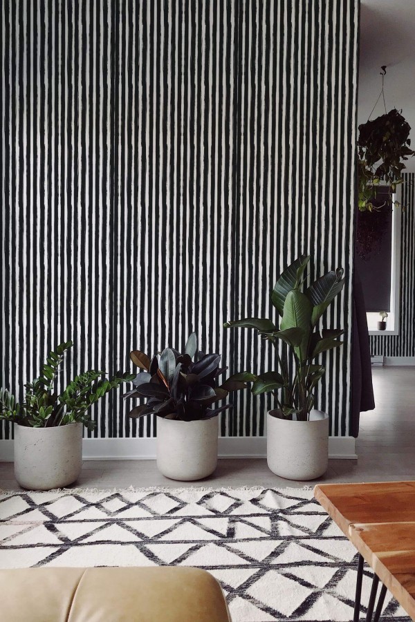 Scandinavian style living room decorated with Brush stroke stripes peel and stick wallpaper
