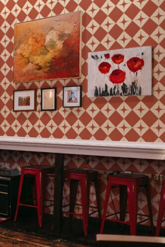 Burnt orange peel and stick wallpaper by Fancy Walls in tile pattern