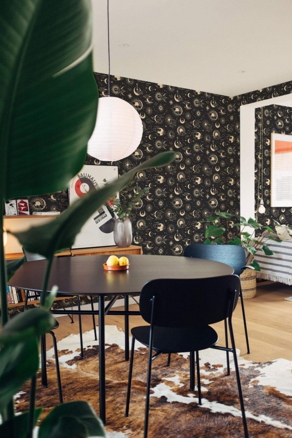 Scandinavian style dining room decorated with Celestial peel and stick wallpaper