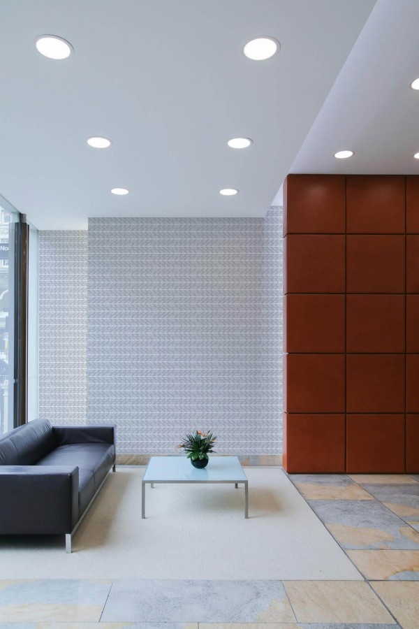Minimal mid-century style living room decorated with Chevron arrow peel and stick wallpaper