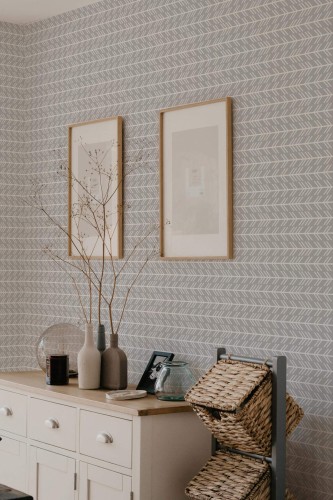 Scandinavian style bedroom decorated with Chevron arrow peel and stick wallpaper