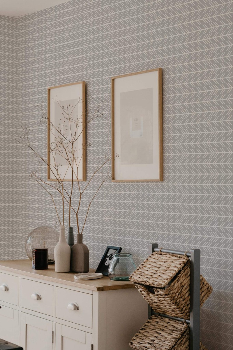 Scandinavian style bedroom decorated with Chevron arrow peel and stick wallpaper