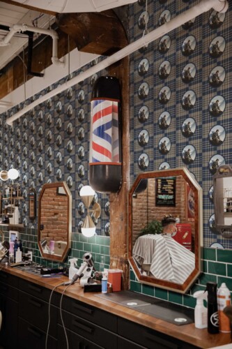 Peel and stick wallpaper with brown plaid Sherlock print by Fancy Walls