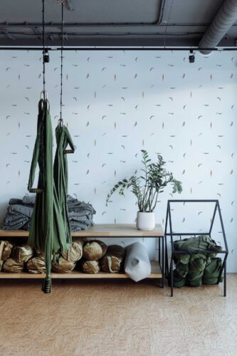 Fancy Walls peel and stick wallpaper with teal swimmers on white
