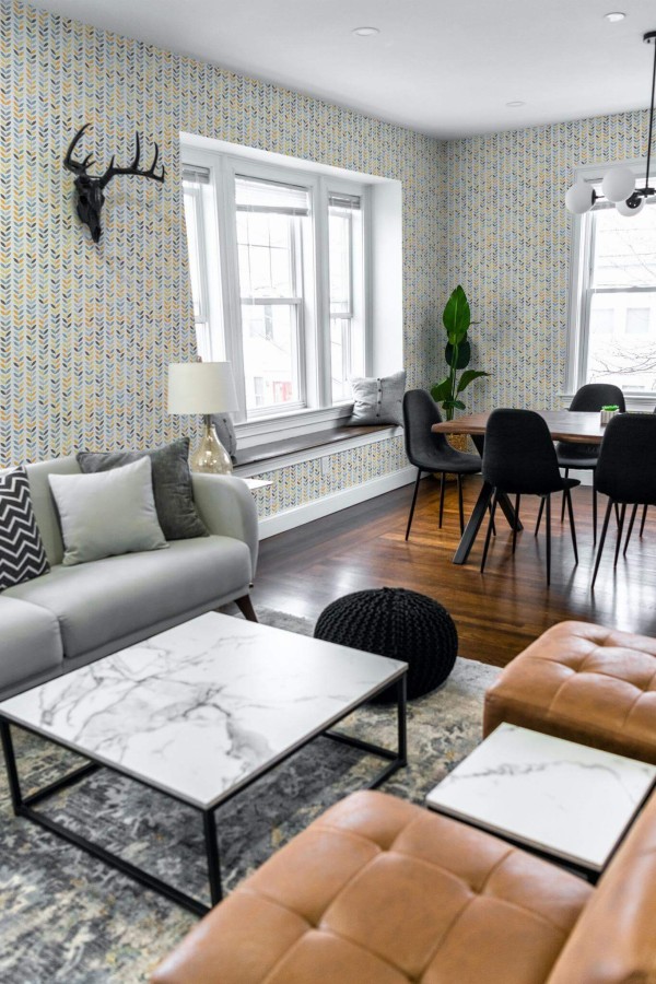 Mid-century modern scandinavian style living dining room decorated with Colorful scandi leaf peel and stick wallpaper