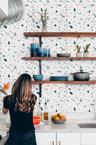 Fancy Walls removable wallpaper with playful scattered terrazzo design