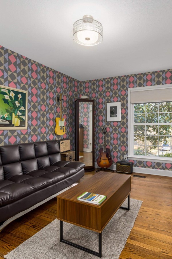 Mid-century style living room decorated with Dark colorful geometric peel and stick wallpaper and music instruments