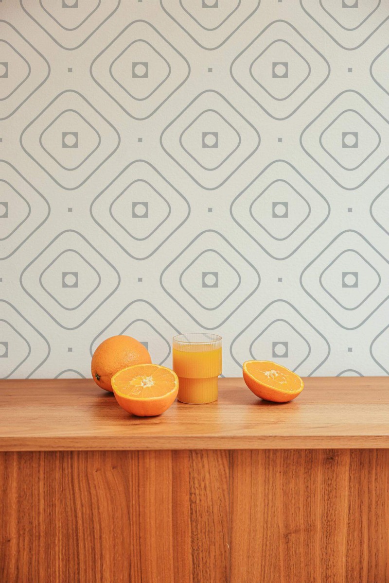 Mid-century style living room decorated with Delicate geometric peel and stick wallpaper