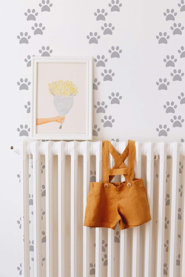 Bohemian style kids room decorated with Dog paw peel and stick wallpaper