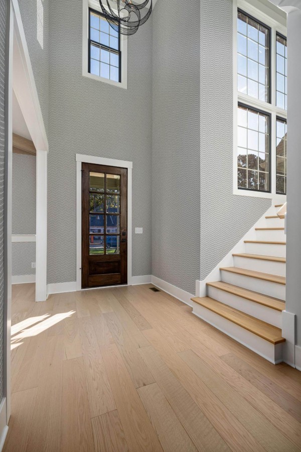 Minimal style entryway decorated with Dotted chevron peel and stick wallpaper