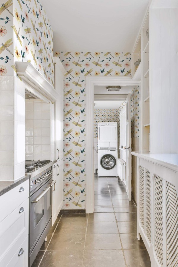 Minimal farmhouse style laundry room decorated with Dragonfly peel and stick wallpaper