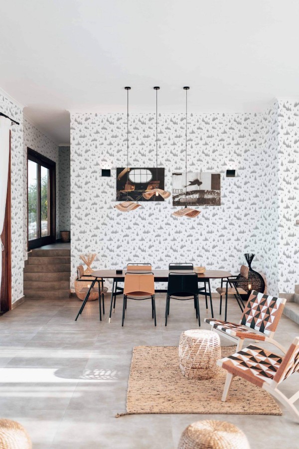 Modern boho style living dining room decorated with Fir tree peel and stick wallpaper