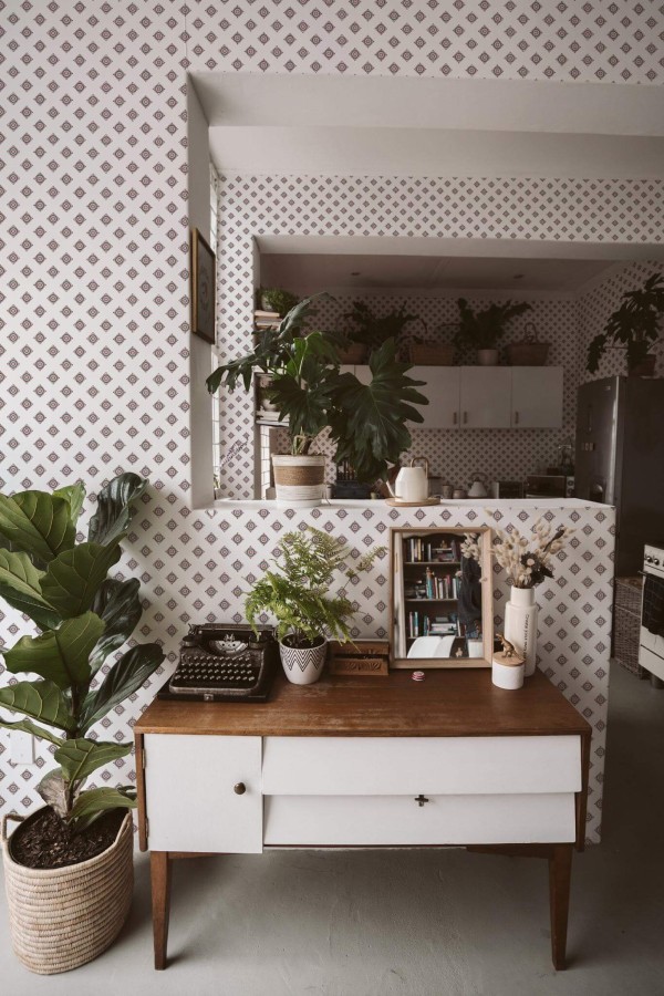 Boho style living room and kitchen decorated with Geometric ornament square peel and stick wallpaper and green plants