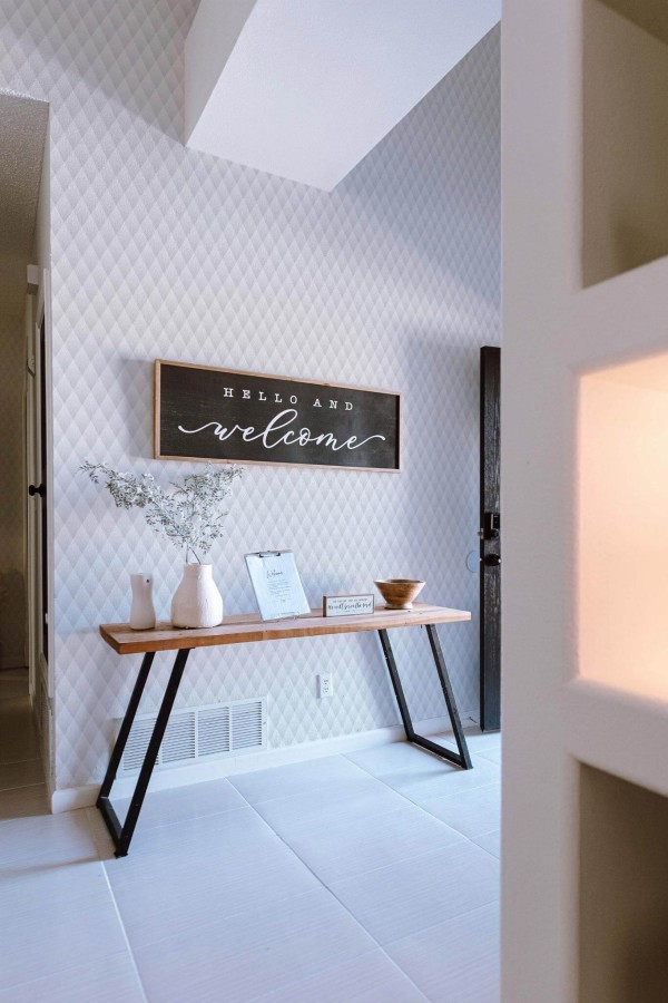 Minimal farmhouse style entryway decorated with Gray harlequin peel and stick wallpaper
