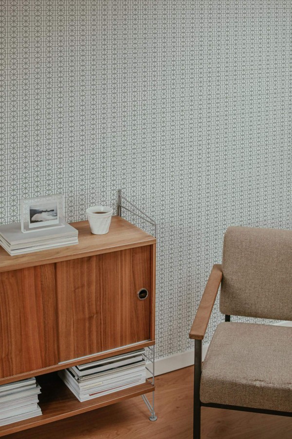 Mid-century style living room decorated with Green and white geometric peel and stick wallpaper