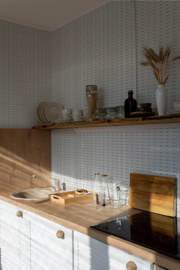 Minimal bohemian style kitchen decorated with Green and white geometric peel and stick wallpaper
