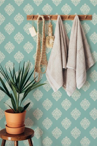 Boho style bathroom decorated with Green damask peel and stick wallpaper