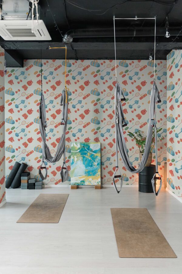 Fancy Walls peel and stick wallpaper with gym-themed decor