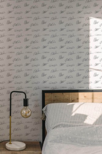 Minimal modern style bedroom decorated with Handwriting peel and stick wallpaper