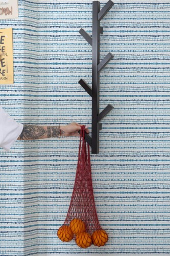 Scandinavian style kitchen decorated with Ikat lines peel and stick wallpaper