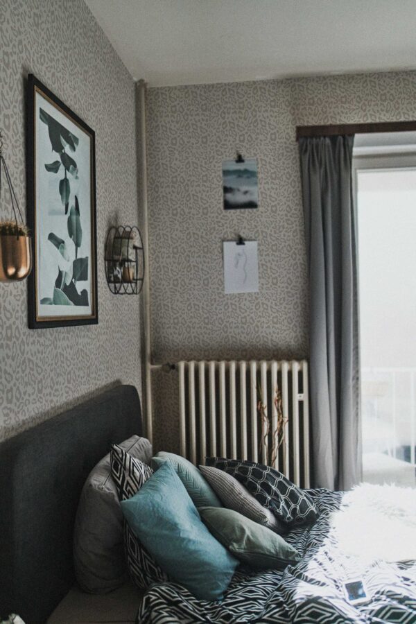 Self-adhesive wallpaper with light greige animal print by Fancy Walls