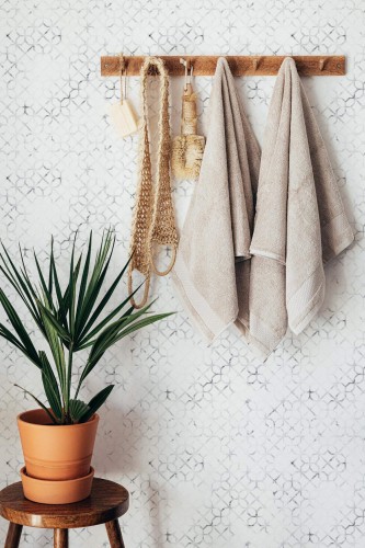 Boho style bathroom decorated with Marble morocco peel and stick wallpaper
