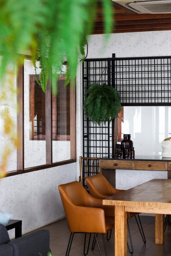 Mid-century modern style dining room decorated with Marble morocco peel and stick wallpaper and black industrial accents
