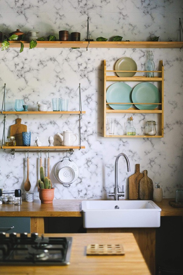 Rustic farmhouse style kitchen decorated with Marble peel and stick wallpaper