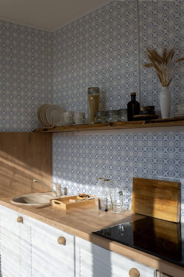 Minimal bohemian style kitchen decorated with Ornamental blue peel and stick wallpaper