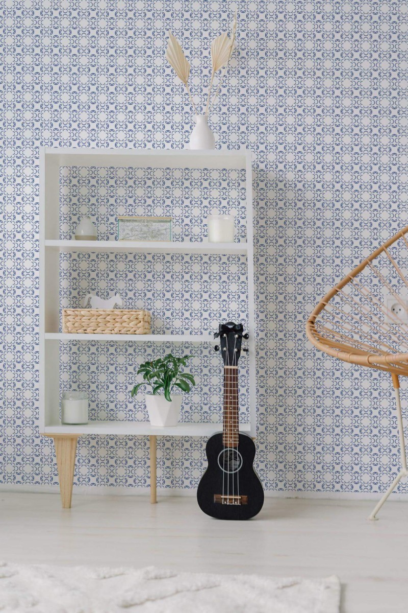 Minimal boho style living room decorated with Ornamental blue peel and stick wallpaper