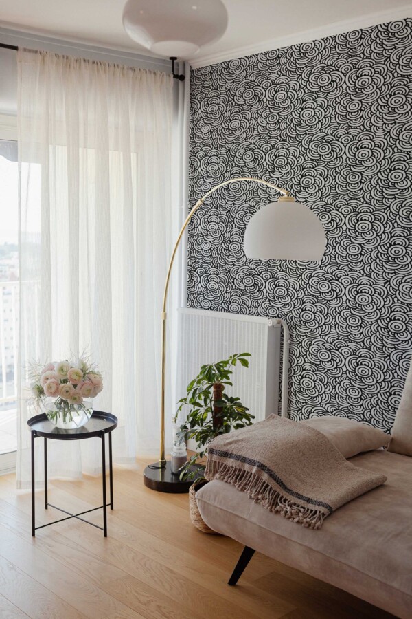Modern self-adhesive wallpaper by Fancy Walls with concentric circle motif in black and white