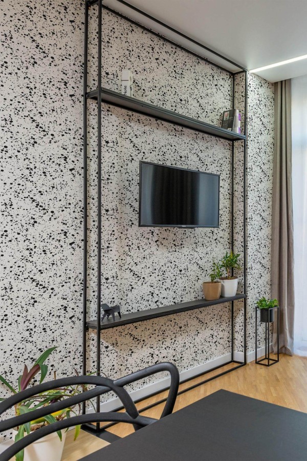 Industrial style living room decorated with Paint splash peel and stick wallpaper