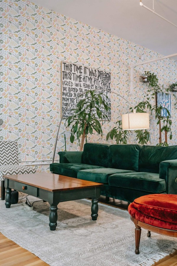 Bold eclectic style living room decorated with Pastel abstract coral peel and stick wallpaper and emerald green sofa