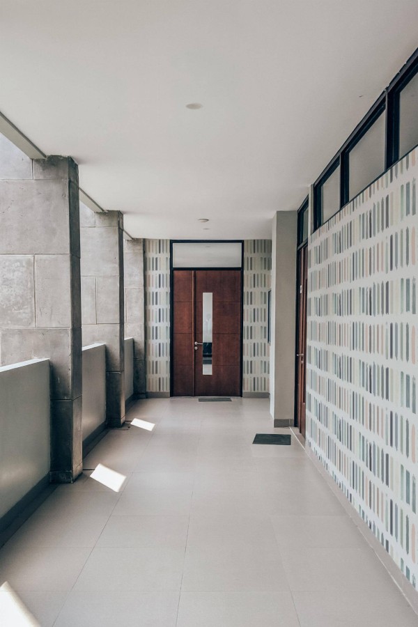 Industrial style hallway with a balcony decorated with Pastel Brush stroke peel and stick wallpaper
