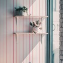 Industrial style cafe decorated with Pink striped peel and stick wallpaper