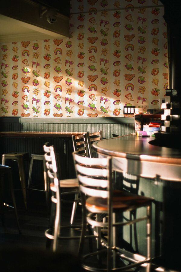 Retro peel and stick wallpaper in peach tones by Fancy Walls