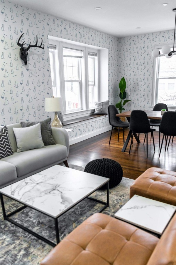 Mid-century modern scandinavian style living dining room decorated with Sailboat peel and stick wallpaper