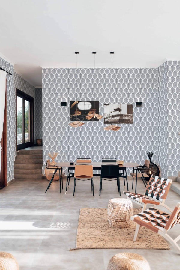 Modern boho style living dining room decorated with Scandi Leaf peel and stick wallpaper
