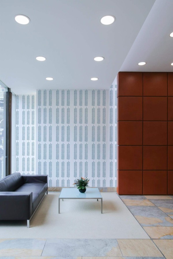 Minimal mid-century style living room decorated with Scandinavian leaf peel and stick wallpaper