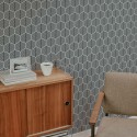 Mid-century style living room decorated with Seamless hexagon peel and stick wallpaper