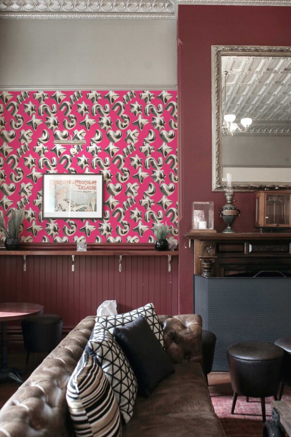Removable wallpaper in bright pink with 3D shapes by Fancy Walls