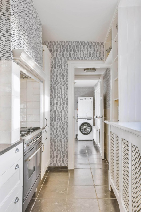 Minimal farmhouse style laundry room decorated with Small zig zag peel and stick wallpaper