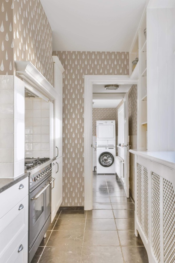 Minimal farmhouse style laundry room decorated with Teardrop pattern peel and stick wallpaper