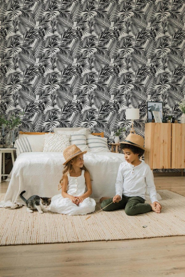 Scandinavian style bedroom decorated with Tropical leaf peel and stick wallpaper