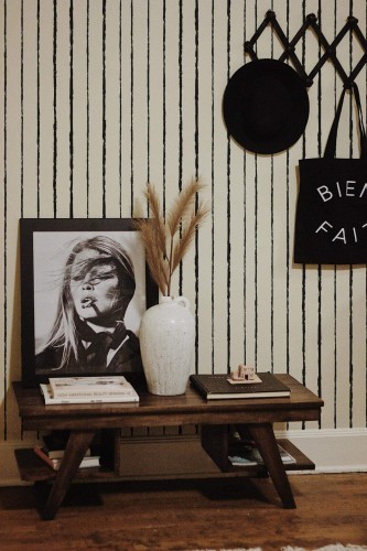 Rustic farmhouse style entryway decorated with Vertical Brush stroke lines peel and stick wallpaper