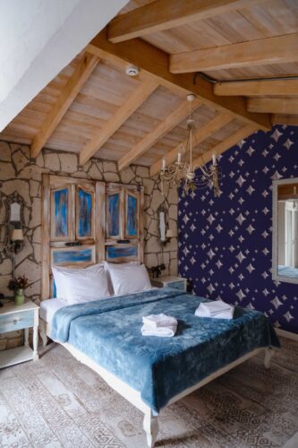 Traditional wallpaper in shimmering blue and pink stars by Fancy Walls