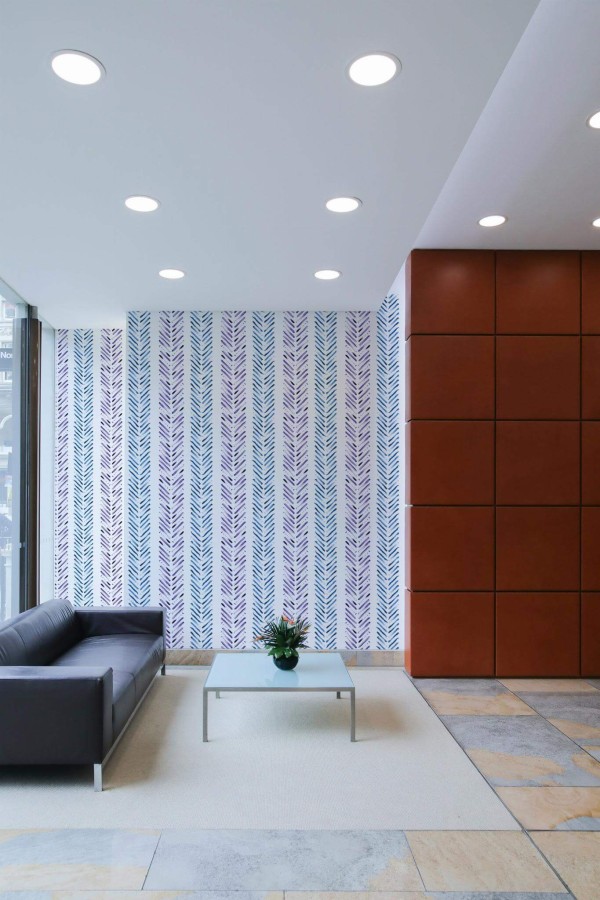 Minimal mid-century style living room decorated with Watercolor herringbone peel and stick wallpaper
