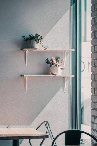 Industrial style cafe decorated with Waves peel and stick wallpaper